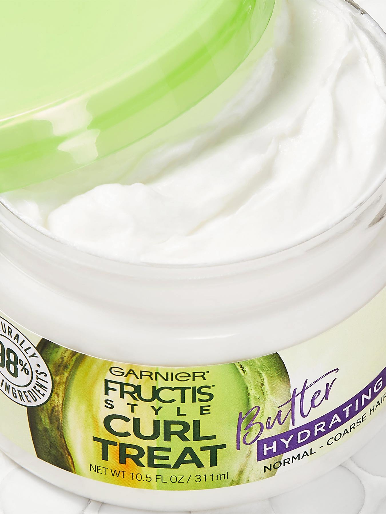Close up view of Curl Treat Butter Hydrating Leave-in Styler to Shape Curls.